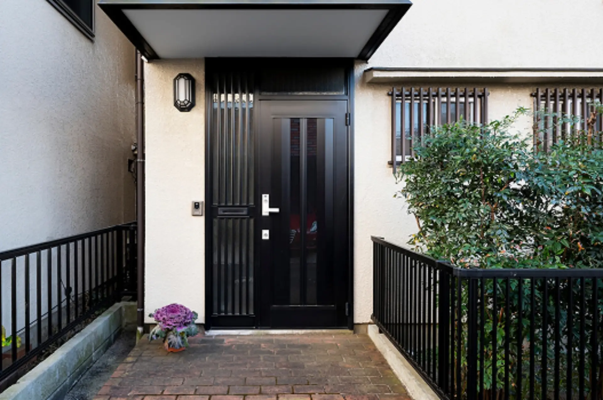 Black front door with white brick exterior Carlow