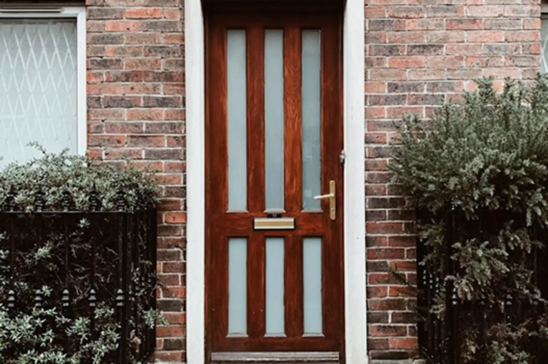 Red wooden front door with brick exterior Carlow